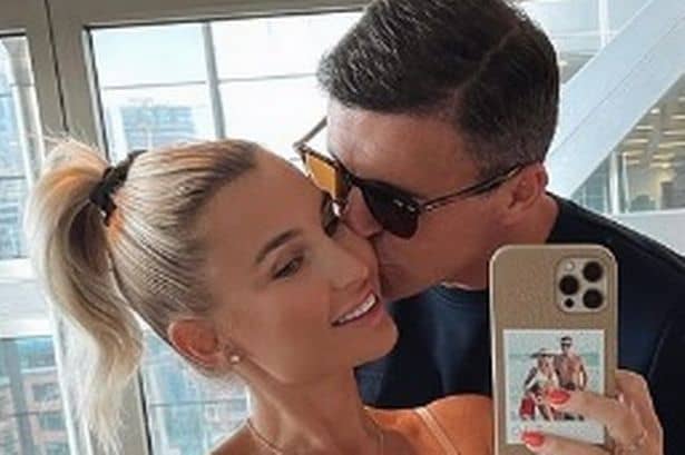 Billie Faiers beams with Greg Shepherd as they cradle blossoming bump: ‘halfway there baby’