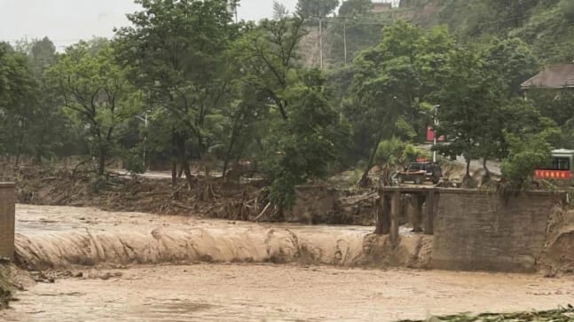 China flash floods leave at least 12 dead, thousands evacuated